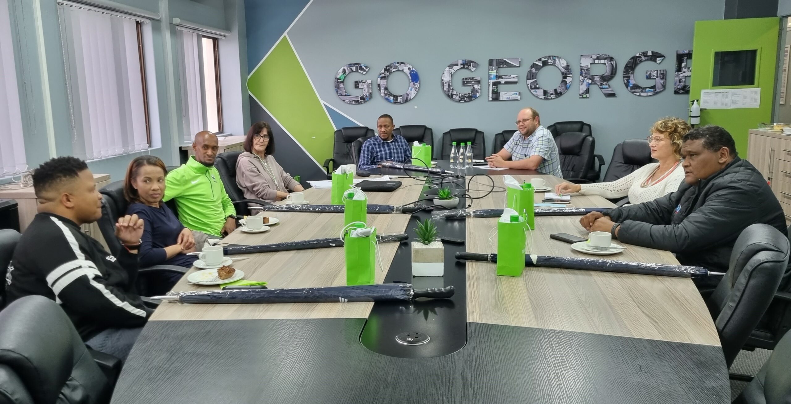 From left are Moses Williams (actor and comedian), Lizette da Silva (George Herald editor), Lloyd Bosman (athlete), Alet van Tonder (GO GEORGE communications team), Peter Jaftha (Manager, Heartbeat FM), James Robb (GO GEORGE Manager), Charmaine Pretorius (GO GEORGE communications team) and Morné Pietersen (Manager, Eden FM). Zane Kirchner, former Springbok rugby player and assistant coach of the SWD Eagles, is also a member of the panel but could not attend the meeting.