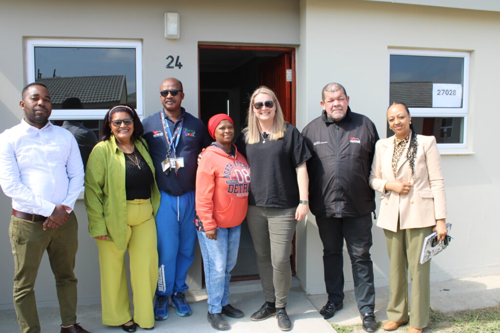 Ten More Families Receive Keys to Their New Homes at Metrogrounds